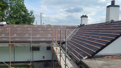 View of the progress of a new roof for a residential home