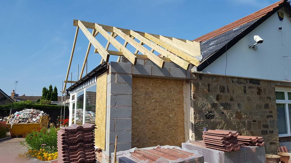 A new roof being added to an home extension