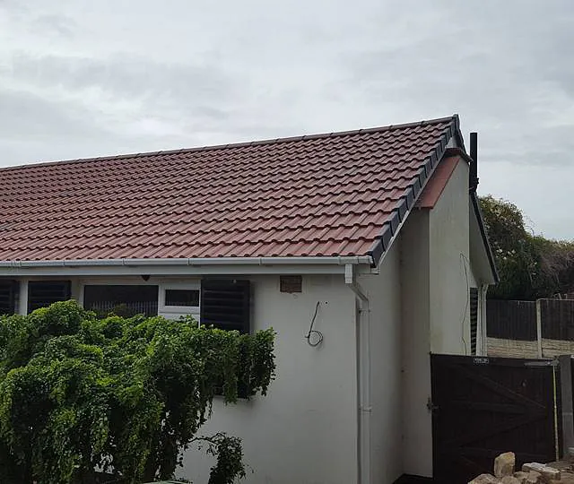 Side view of completed roofing work by our team